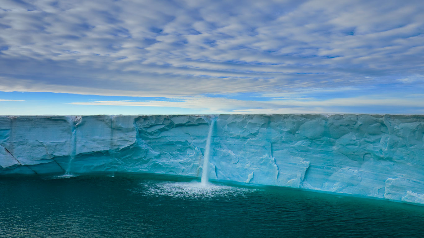 Meltwater creates waterfalls on an ice cap, Svalbard Archipelago, Norway (© Ralph Lee Hopkins/Corbis)(Bing United Kingdom)