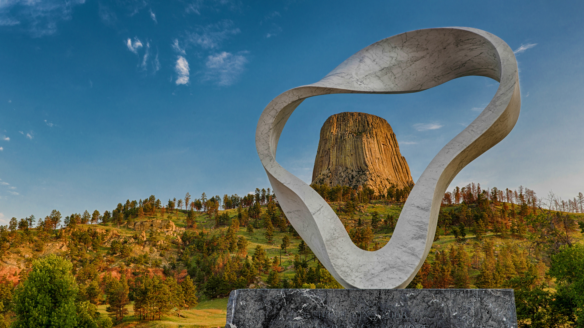 The 'Circle of Sacred Smoke' sculpture by Junkyu Muto frames Devils Tower in Wyoming (© Nagel Photography/Shutterstock)(Bing United States)