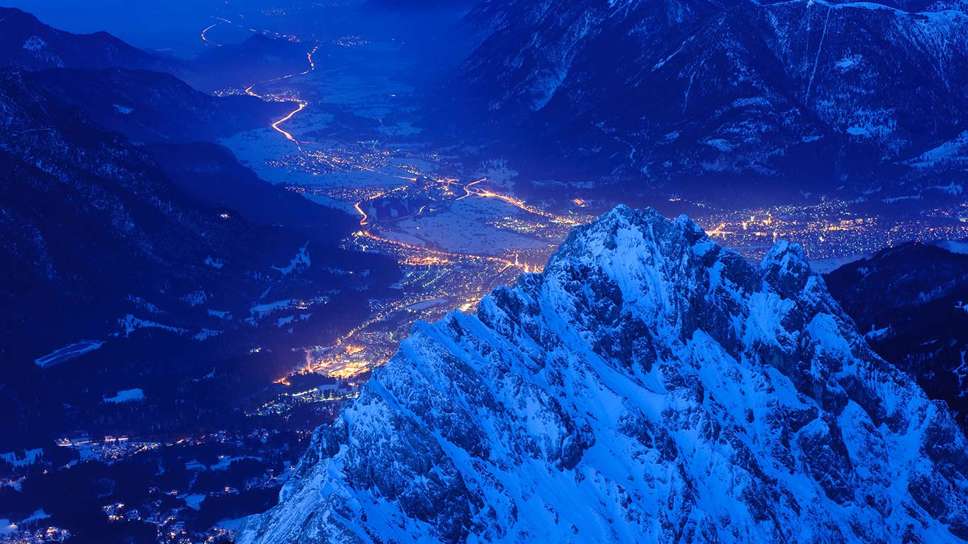 View over Waxenstein crest on illuminated town of Garmisch, Bavaria, Germany (© Olaf Broders Nature Photography/Getty Images)(Bing New Zealand)