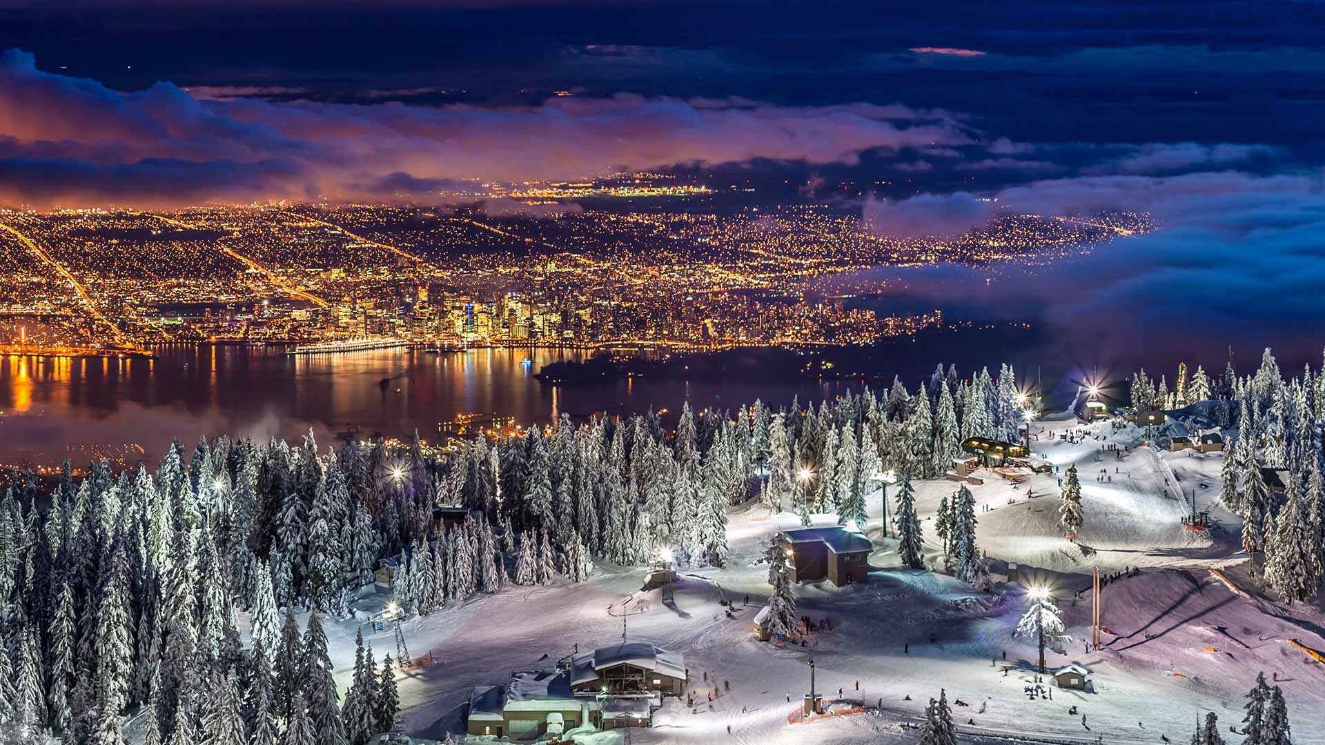 City lights from the snowy peak of Grouse Mountain at twilight, Vancouver (© Pierre Leclerc Photography/Getty Images)(Bing Canada)