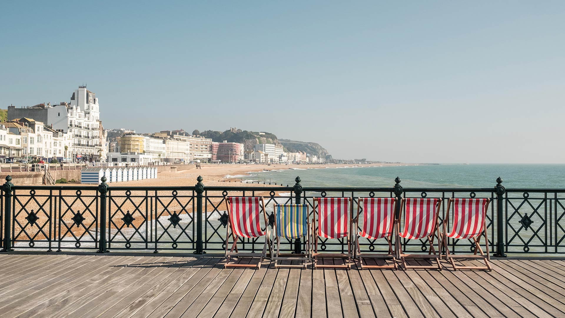 Deckchairs on Hastings Pier, East Sussex, England (© ams images/Alamy)(Bing United Kingdom)