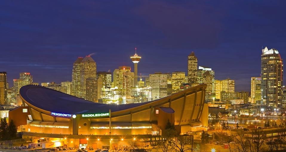 The Saddledome with Calgary Tower and the city skyline in the background at dusk, Calgary, Alberta (© Rolf Hicker/age fotostock) &copy; (Bing Canada)