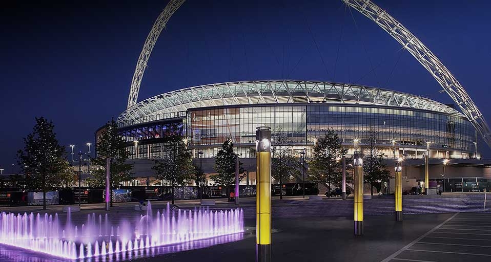 Wembley stadium, London, United Kingdom, night shot with purple fountain in foreground, HOK sport | Foster /Photolibrary &copy; (Bing United Kingdom)