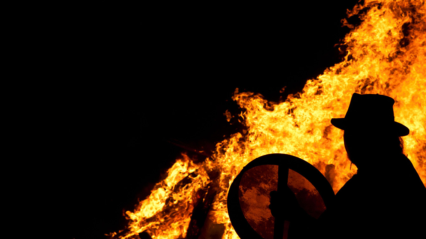 Drummer with a bodhran at a pagan Beltane fire ceremony (© David Isaacson/Alamy)(Bing United Kingdom)