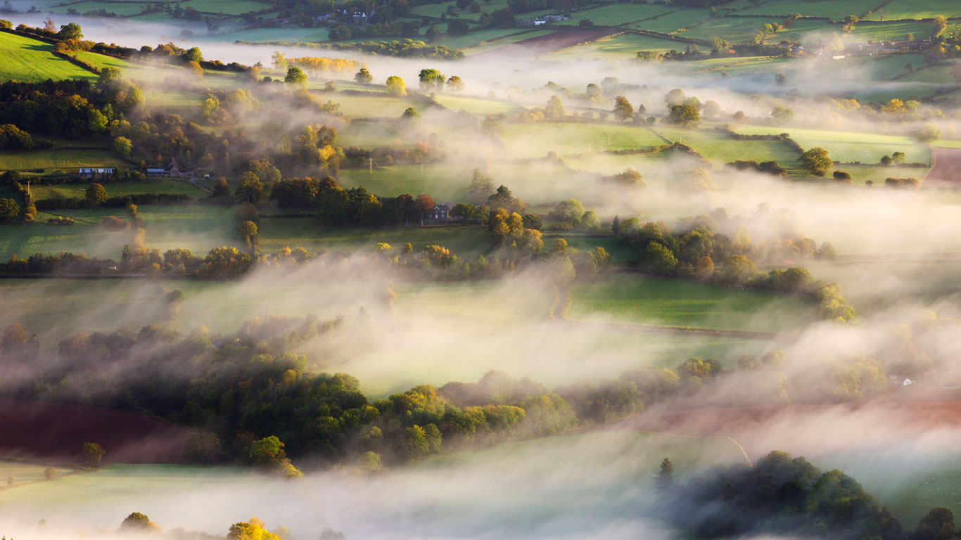 Mist blows over rolling countryside near Talybont-on-Usk in Brecon Beacons National Park, Wales (© Adam Burton/Alamy)(Bing United Kingdom)