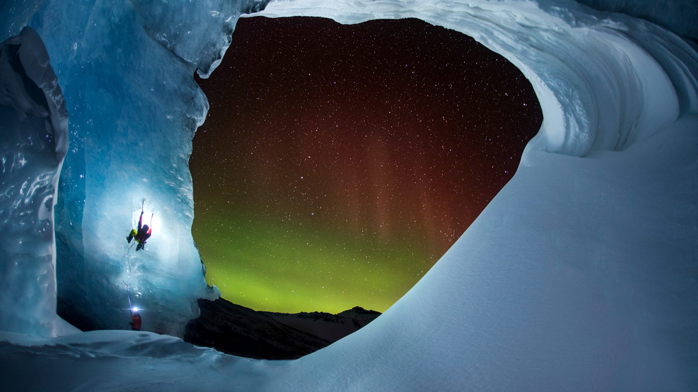 Climbing Athabasca Glacier in Jasper National Park, Alberta, Canada as the Aurora Borealis glows (© Paul Zizka/Aurora Photos)(Bing Canada)