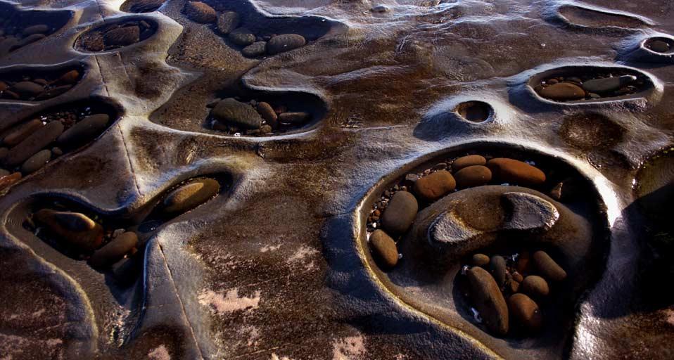 Mini rock pools on beach near Carisbrook Falls Reserve (© Mark Parkes /Getty Images)(Bing Australia)