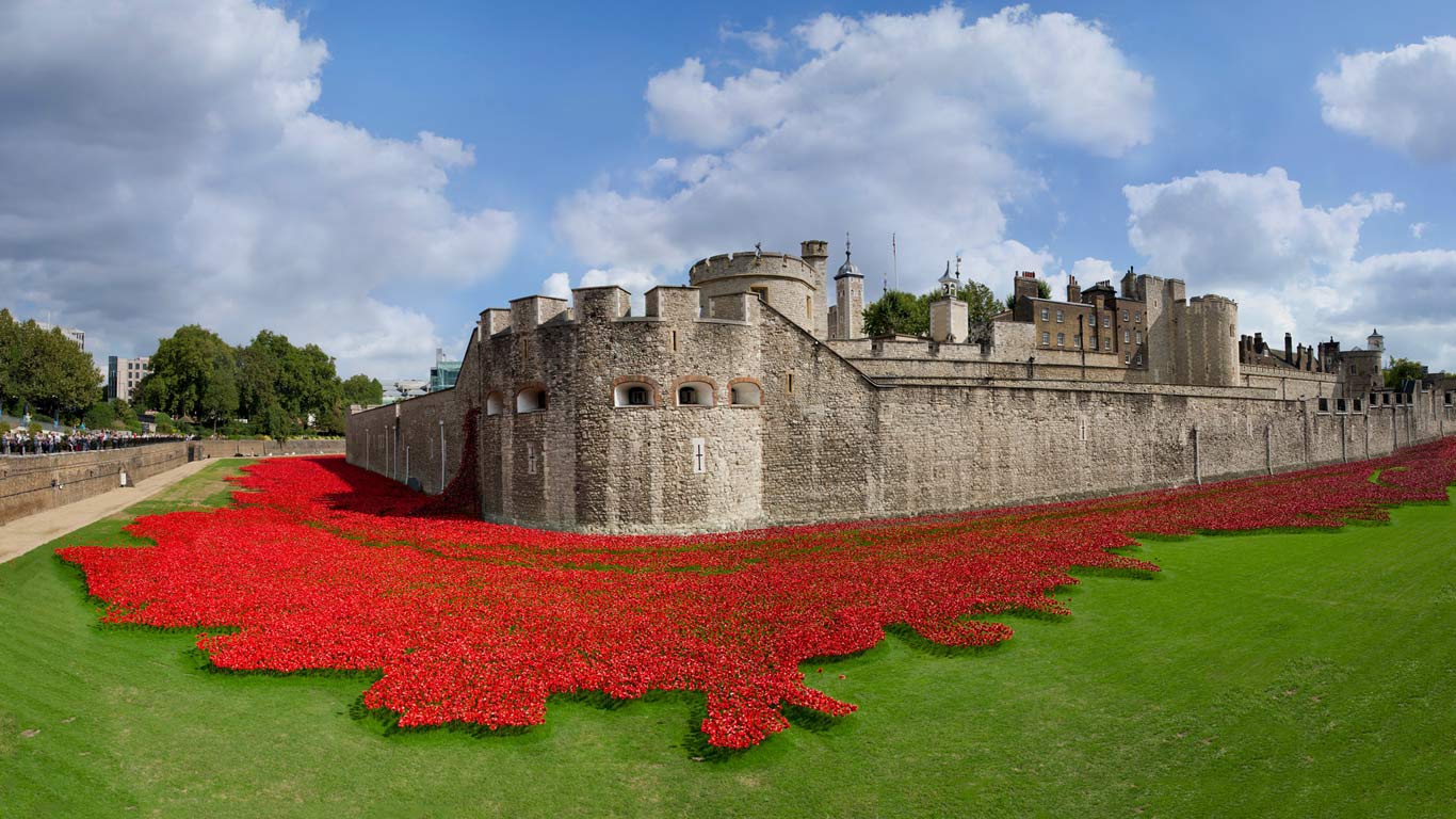 Tower of London surrounded by ceramic poppies, art installation created by Paul Cummins in honor of the 100th anniversary of the beginning of World War I, London, England (© Philip Sayer/Alamy)(Bing United States)