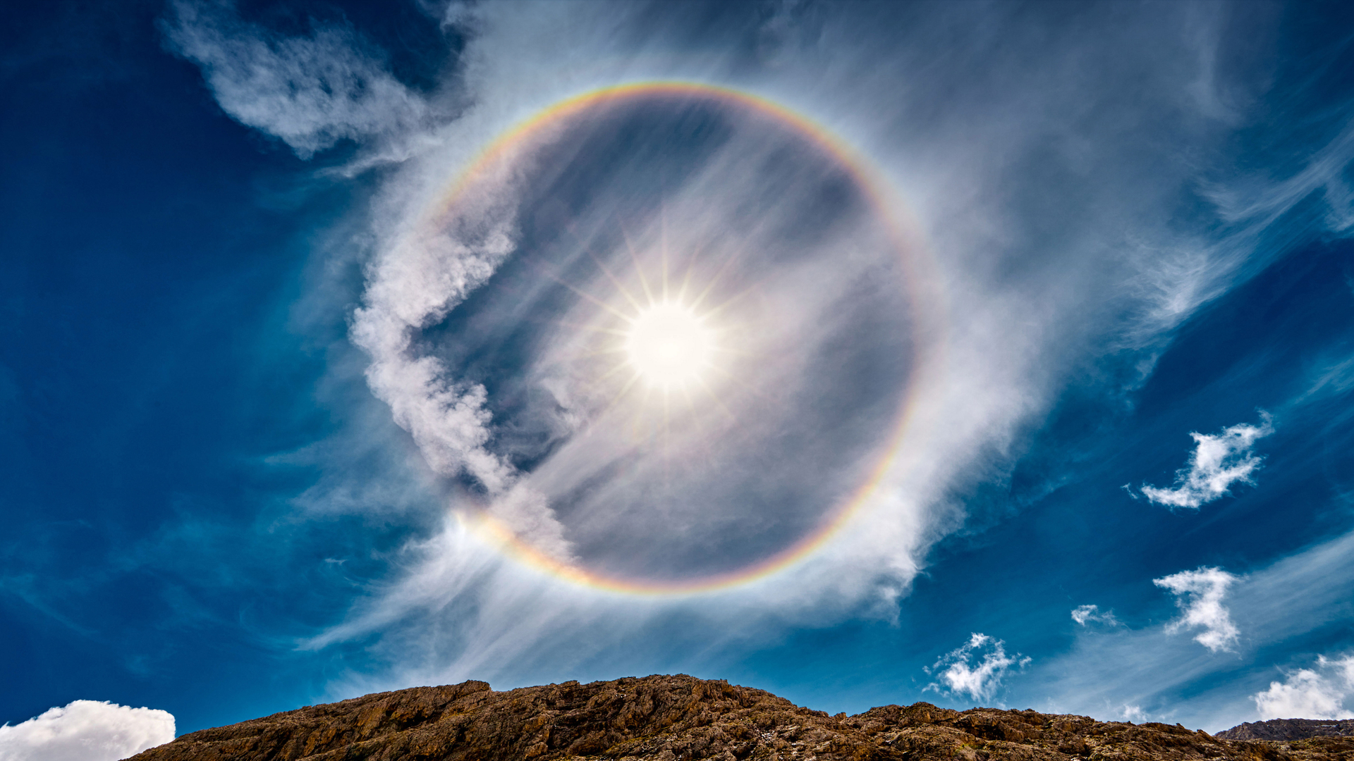 Sun halo, Lake Antermoia, Dolomite mountains, Italy (© Walter Donega/Getty Images)(Bing New Zealand)