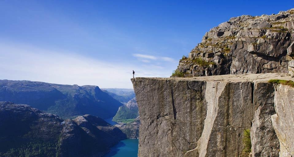Man standing on Preikestolen Pulpit Rock, Lysefjord, Norway (© Christian Kober/Age Fotostock) &copy; (Bing United Kingdom)