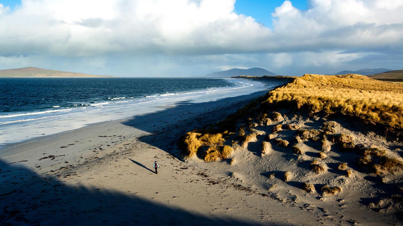 Woman walks on west beach, Berneray, Outer Hebrides, Scotland (© Cody Duncan/Aurora Photos)(Bing United Kingdom)