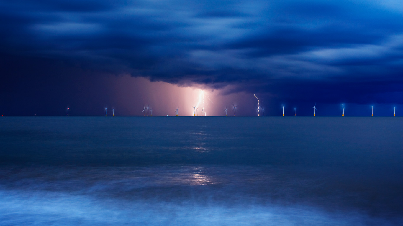Offshore wind farm at Great Yarmouth in Norfolk in a lightning storm, England (© Jon Gibbs/Getty Images)(Bing United Kingdom)