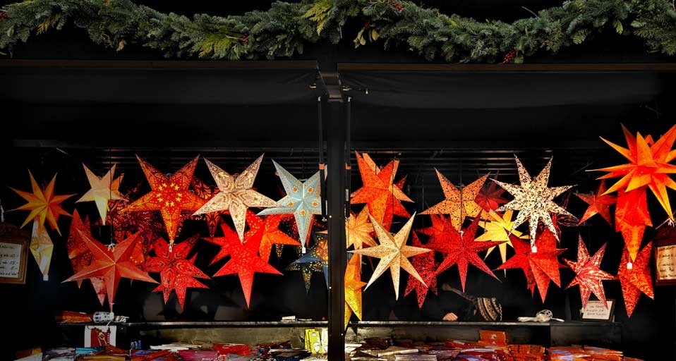 Luminous stars decorations in stall at the Christmas Market at the Town Hall in Munich, Germany -- imagebroker.net/Photolibrary &copy; (Bing Canada)