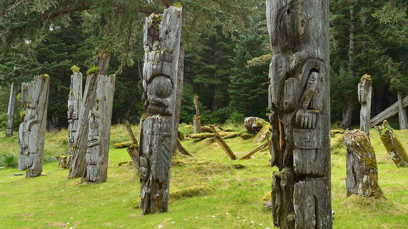 Mortuary poles containing remains of high status people (© Jonathan Kingston/Getty Images)(Bing Canada)