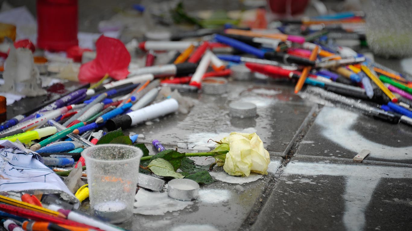 Tributes of candles, pens and flowers at Place de la Republique, Paris, France (© Kristy Sparow/Getty Images)(Bing United Kingdom)