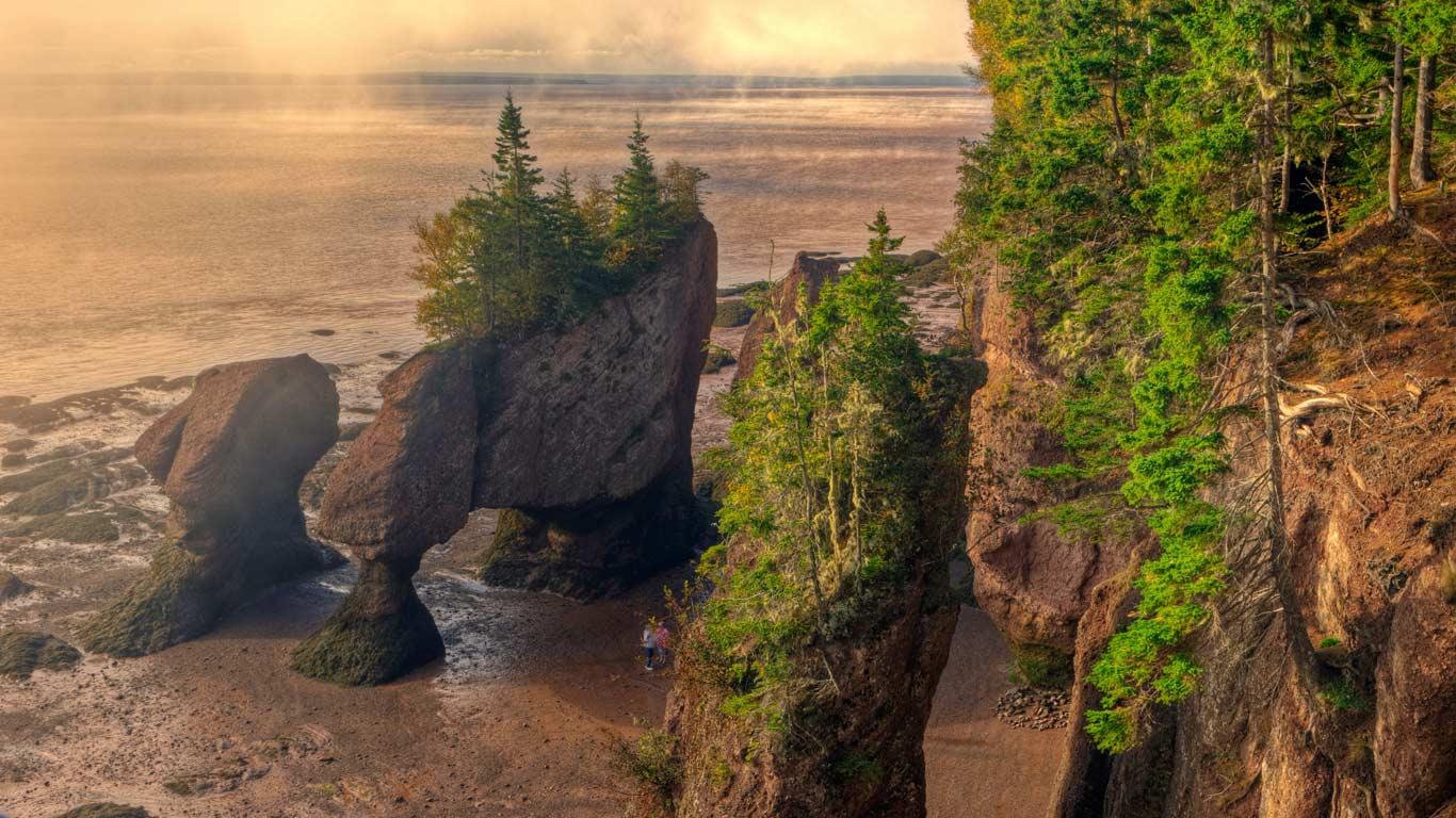 Fog Lifting, Hopewell Rocks, Flowerpots, Sandstone, Hopewell, Bay of Fundy, New Brunswick (© All Canada Photos/Alamy)(Bing Canada)