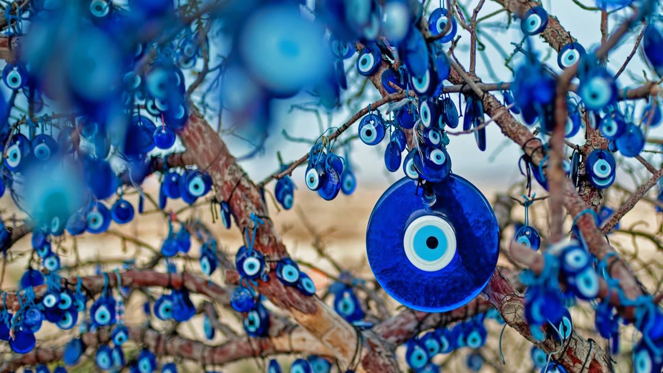 Tree decorated with amulets called nazars, Goreme National Park, Cappadocia, Turkey (© taratata/Getty Images)(Bing United Kingdom)