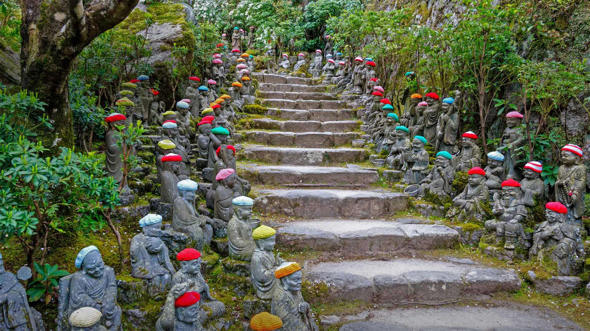 Small rakan statues line the stone pathway to the Daisho-in Temple, Miyajima, Japan (© Malcolm Fairman/Alamy)(Bing United Kingdom)