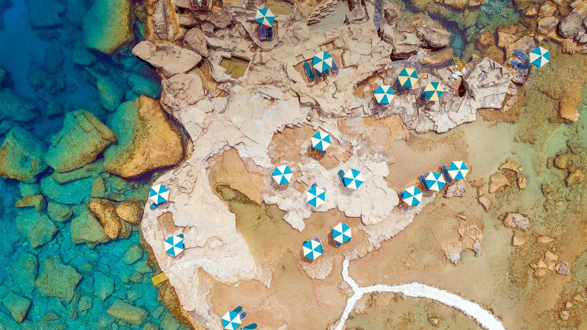Aerial view of blue and white parasols on the coast of Rhodes, Greece (© Amazing Aerial Agency/Offset by Shutterstock)(Bing United Kingdom)