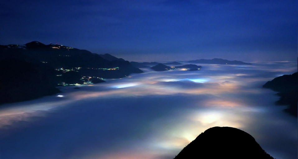 A layer of low clouds covers Olginate Lake and the villages around its banks, near Lake Como, Italy  -- Stefano Anghileri/National Geographic Your Shot &copy; (Bing United States)