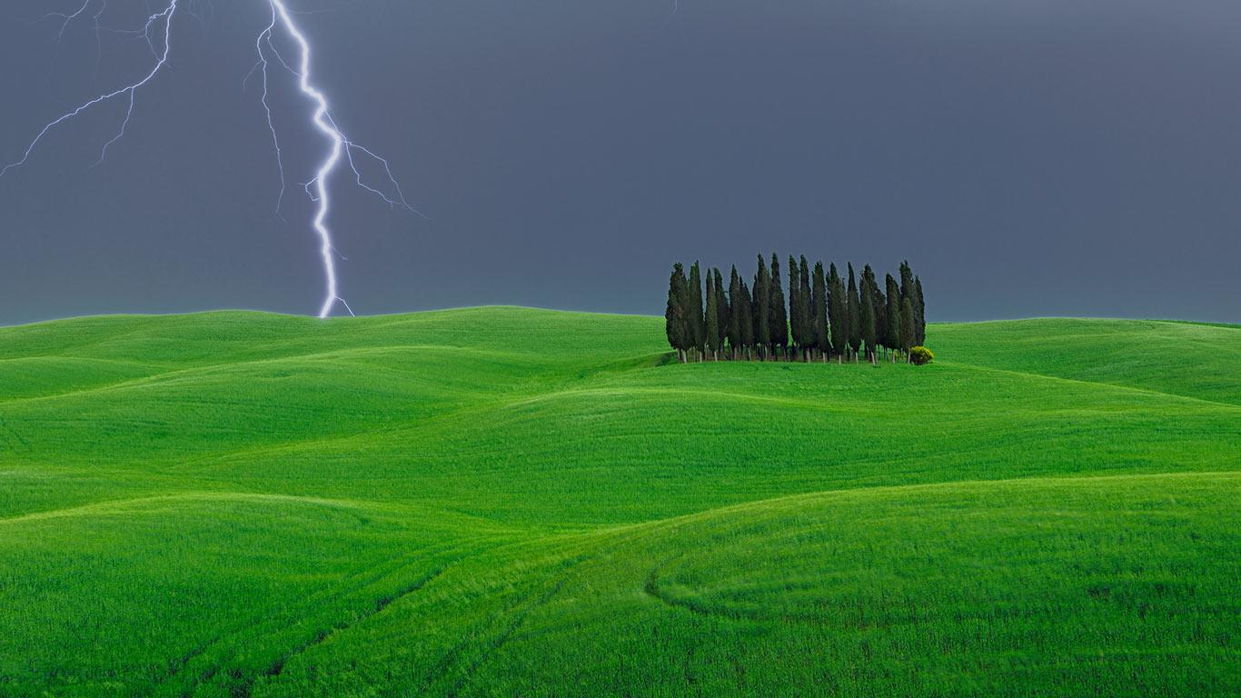 Lightning strike near a grove of cypress trees, Val d’Orcia, Italy (© Martin Ruegner/Getty Images)(Bing United Kingdom)
