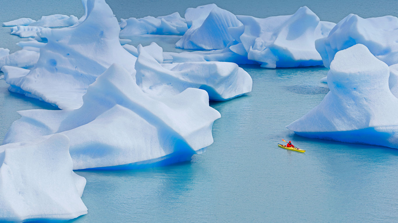 A kayaker crosses Grey Lake in Torres del Paine National Park, Chile (© Marco Simoni/Aurora Photos)(Bing United Kingdom)