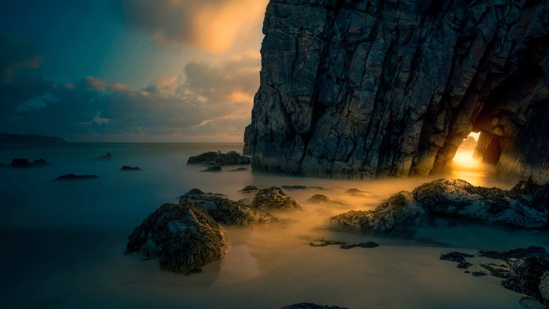 Light from sunrise through a sea cave on the Isle of Skye, Scotland (© Luca Benini/PLM Collection/Offset)(Bing United Kingdom)