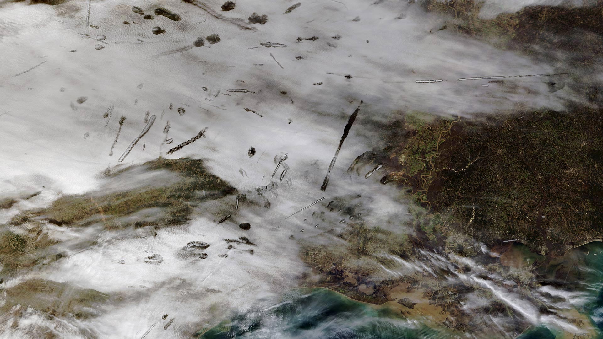 From Nasa’s Terra satellite, an image of fallstreak holes in clouds over the southern United States (© NASA)(Bing United Kingdom)