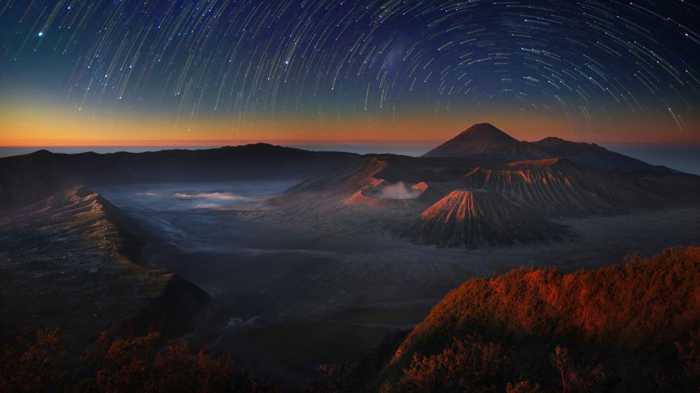 Time-lapse exposure of the night sky above Bromo Tengger Semeru National Park in East Java, Indonesia  (© Weerapong Chaipuck/In cooperation with 500px)(Bing United States)