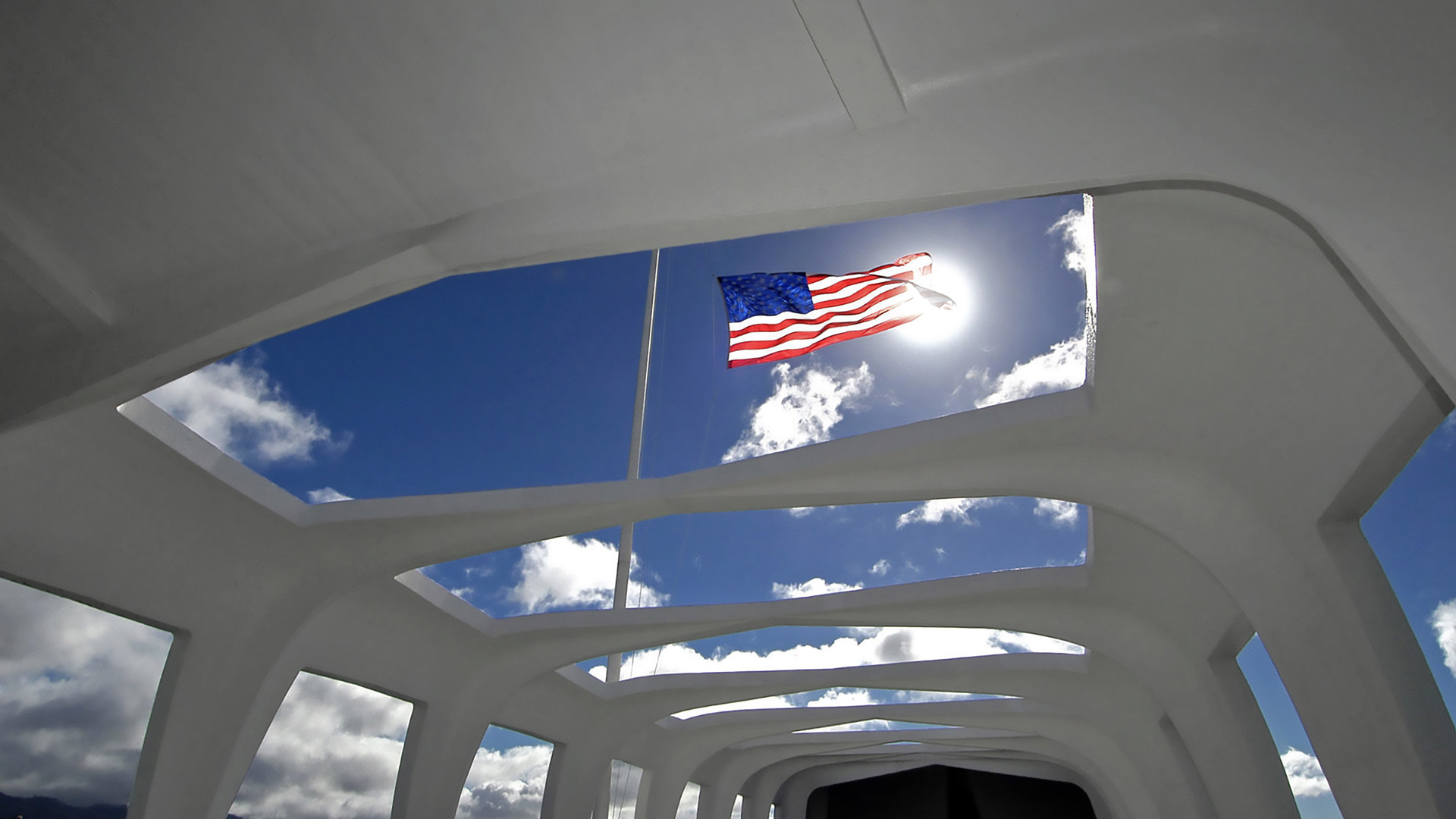 Flag above the USS Arizona Memorial in Honolulu, Hawaii (© PJF Military Collection/Alamy)(Bing United States)
