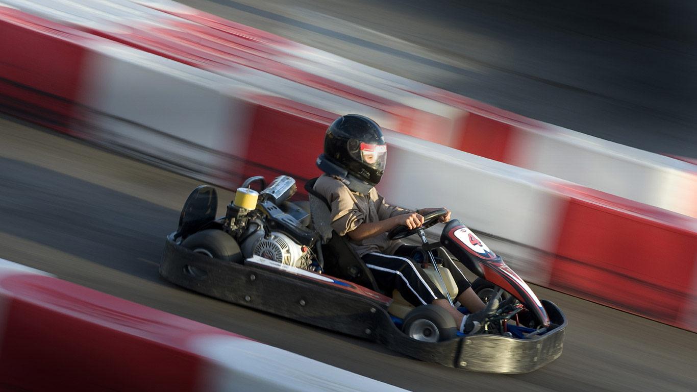 Go-kart racing on a track, side view (©Transtock / SuperStock)(Bing United Kingdom)