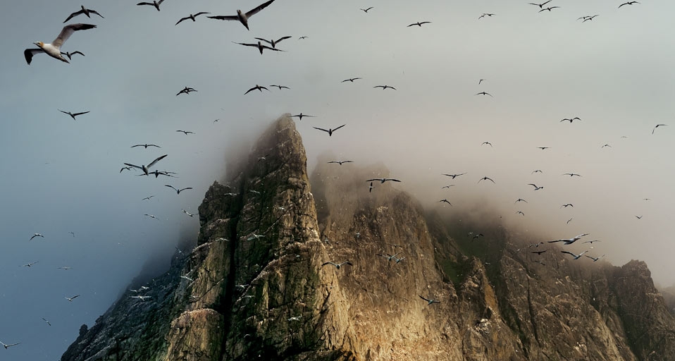 Clouds cover a seabird rookery high on a sea stack cliff on Boreray Island, St. Kilda archipelago, Scotland (© Jim Richardson/Corbis) &copy; (Bing United Kingdom)