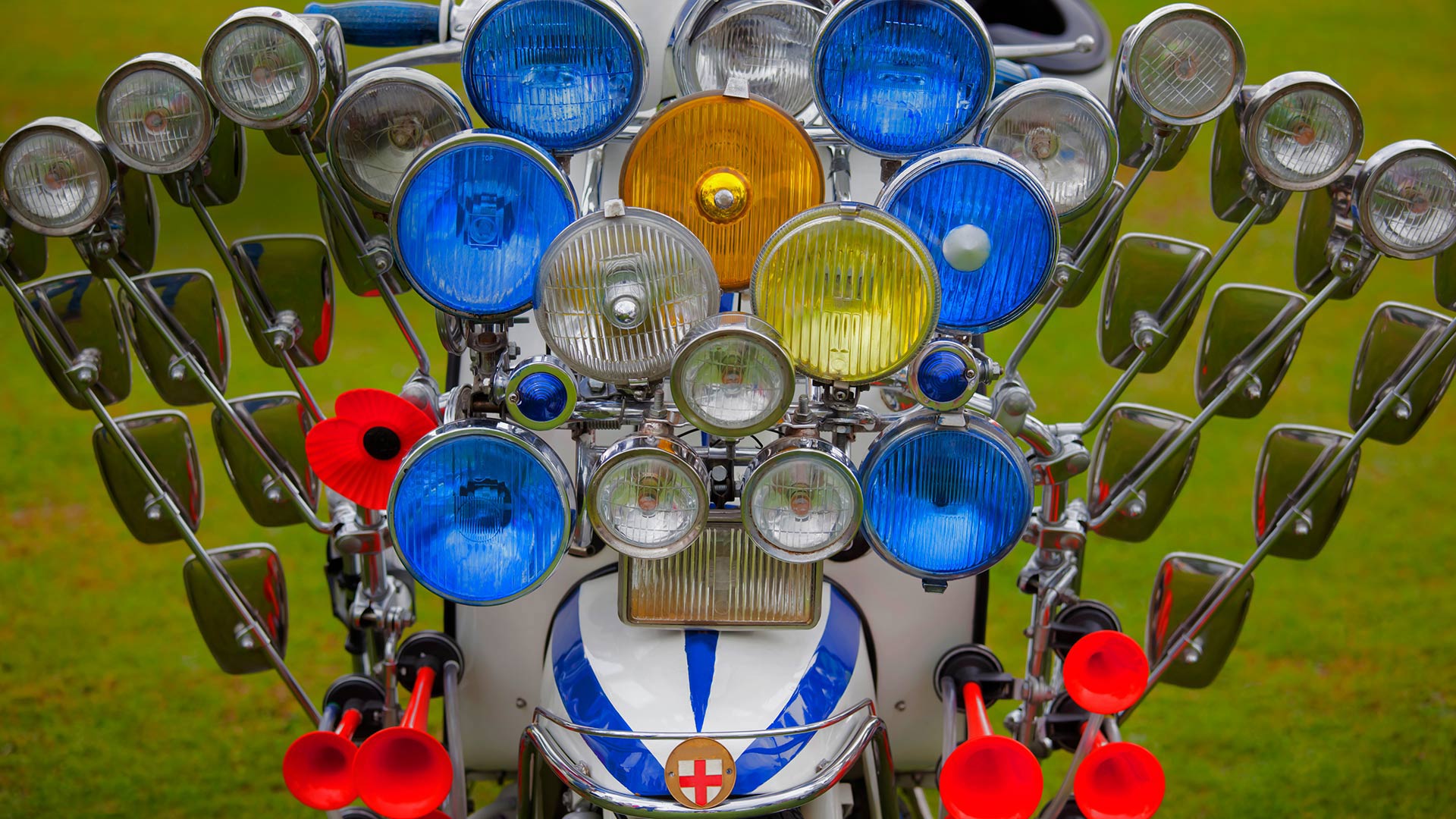 A scooter adorned with multiple mirrors, lights, and air horns (© stocknshares/Getty Images)(Bing Canada)