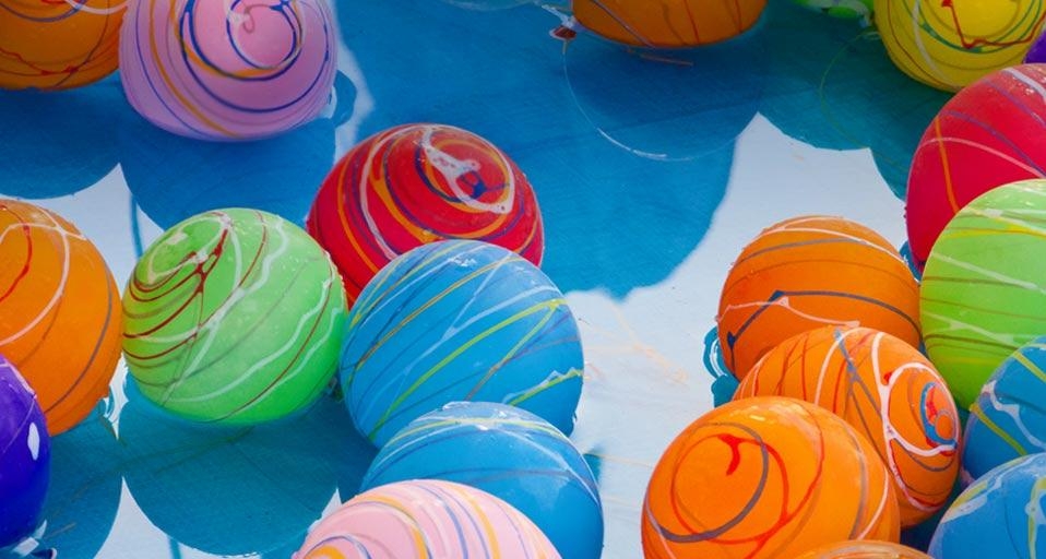 Yoyo tsuri water balloons in the pool at a neighborhood festival in Japan (© Hiroyuki Uchiyama/Getty Images) &copy; (Bing United Kingdom)