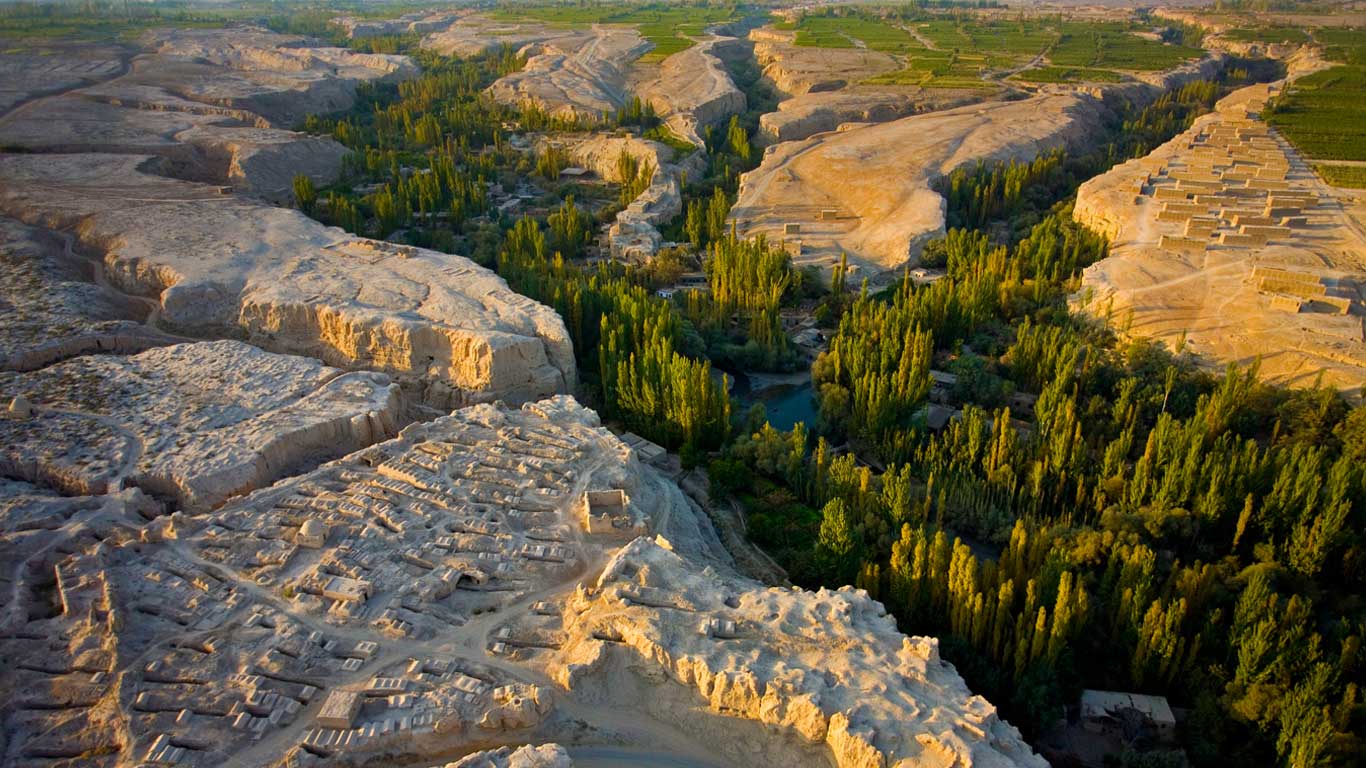 A cemetery overlooking the river gorge in the Turpan Depression, Xinjiang, China (© George Steinmetz/Corbis)(Bing United Kingdom)