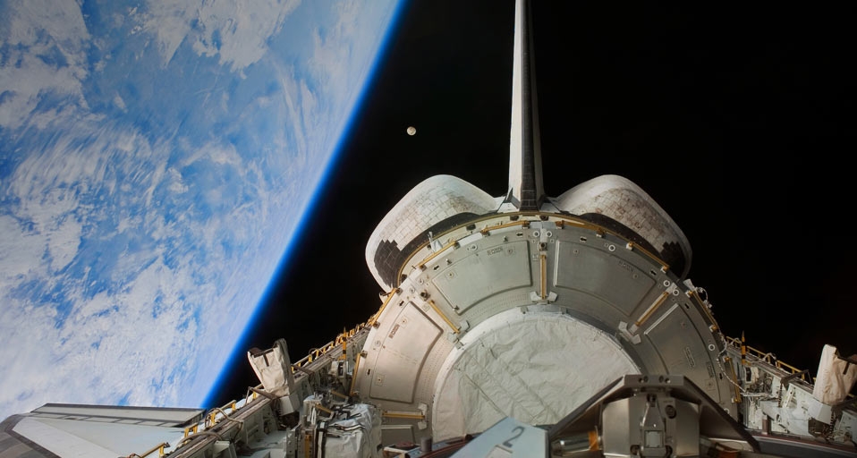 Space Shuttle Discovery backdropped by Earth and the Moon --  Stocktrek Images/Getty &copy; (Bing United Kingdom)