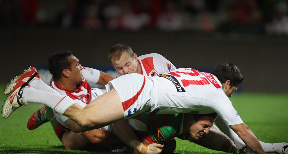 NRL Rd 26 - Dragons v Rabbitohs/SYDNEY, AUSTRALIA - SEPTEMBER 05: Sam Burgess of the Rabbitohs is tackled during the match between the St George Illawarra Dragons and the South Sydney Rabbitohs at WIN -- Mark Kolbe/Getty Images &copy; (Bing Australia)