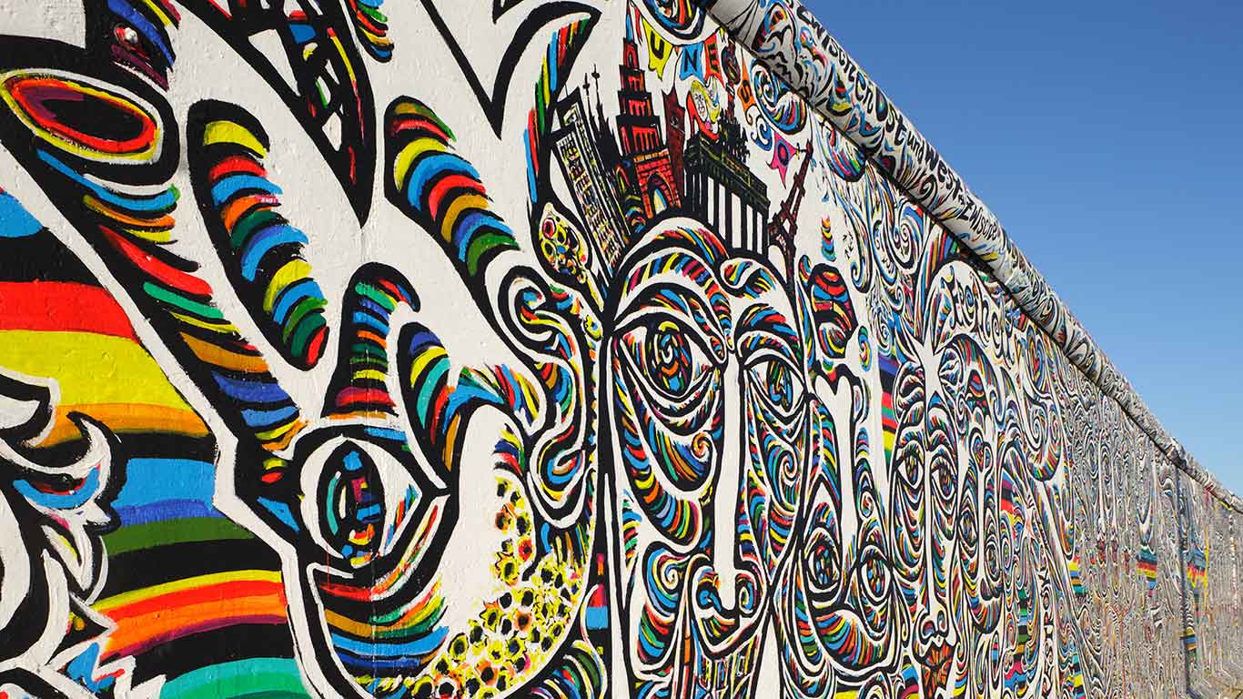 Shamil Gimajew’s ‘We Are A People’ on the renovated East Side Gallery of the Berlin Wall, Berlin, Germany (© Andreas Muhs/Alamy)(Bing United Kingdom)