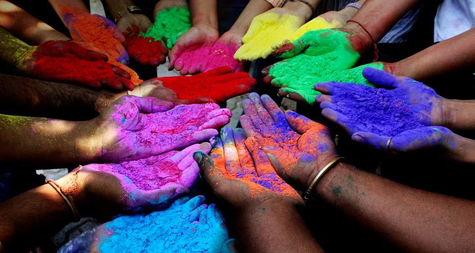 People holding powder paints to celebrate Holi (Festival of Colors) in Ahmedabad, India (© Amit Dave/Corbis)(Bing United Kingdom)