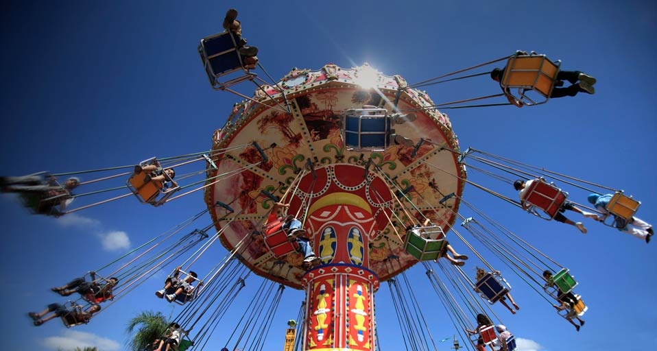 Kids enjoying an amusement park ride on Eid in the West Bank city of Tulkarm -- Zhao Yue/Corbis &copy; (Bing Canada)