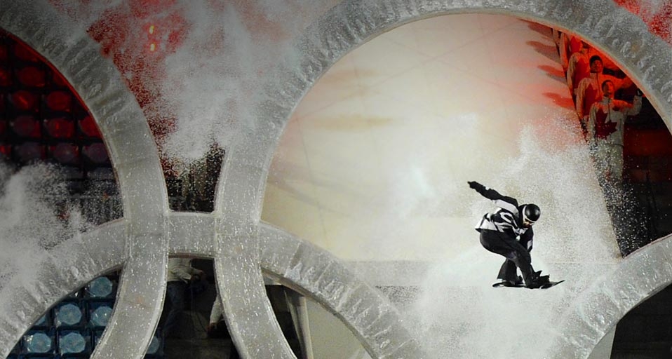A snowboarder flies through the centre ring of the Olympic Rings during the opening ceremony of the 2010 Winter Olympics in Vancouver, Canada - Michael Kappeler/Getty Images &copy; (Bing United Kingdom)
