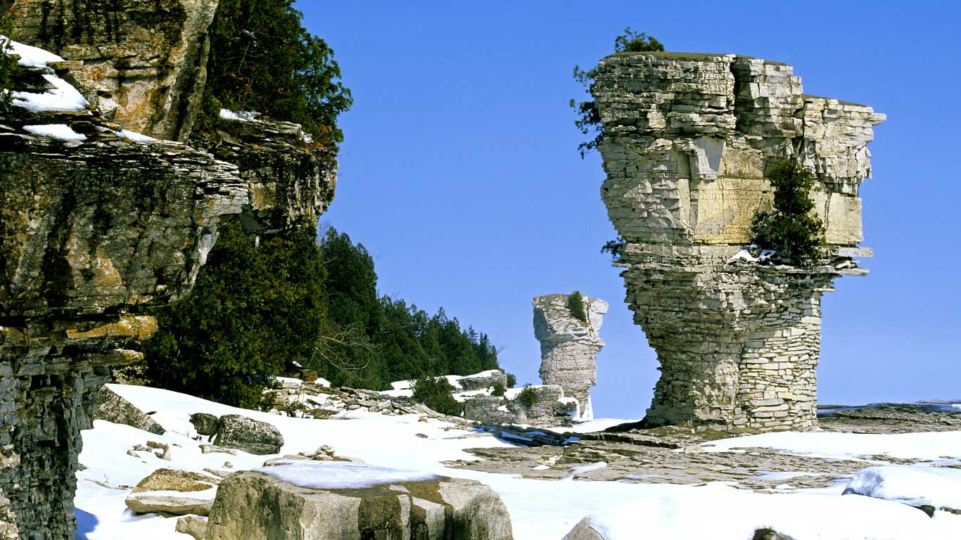 The famous flowerpots, eroded limestone formations, located on the shoreline of Flowerpot Island, Georgian Bay, in Fathom Five National Marine Park, Ontario (© Ethan Meleg/All Canada Photos/Getty Images)(Bing Canada)