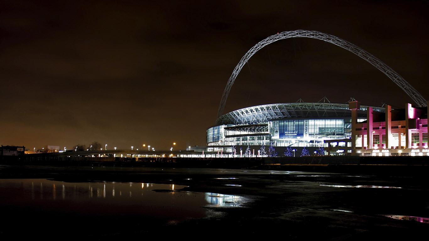 A view across the water to an illuminated Wembley Stadium at night (© Phil Norton/Age Fotostock)(Bing United Kingdom)