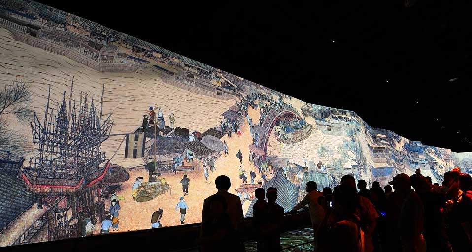 Visitors view the dynamic version of the famous Chinese picture "Riverside Scene at Qingming Festival" at the China Pavilion in the World Expo park in Shanghai, China -- Xu Jiajun/Corbis &copy; (Bing New Zealand)