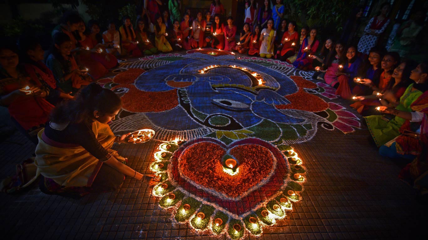 Students light oil lamps to celebrate Diwali in Guwahati, India (© Anuwar Hazarika/Reuters)(Bing United Kingdom)