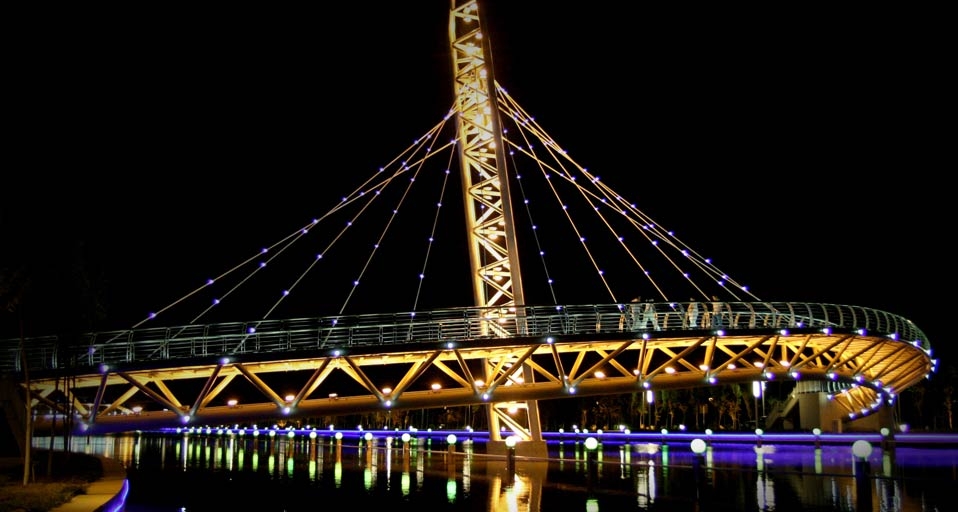 Illuminated bridge in the Karamay River Scenic Area in Karamay, Xinjiang Uygur Autonomous Region , China -- Zhou Jianling/Corbis &copy; (Bing Canada)