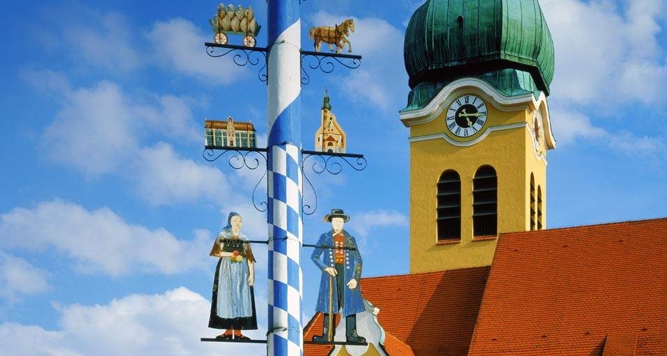 Maypole in front of a church in Wolnzach, Bavaria, Germany (© Guenter Rossenbach/Corbis) &copy; (Bing United Kingdom)
