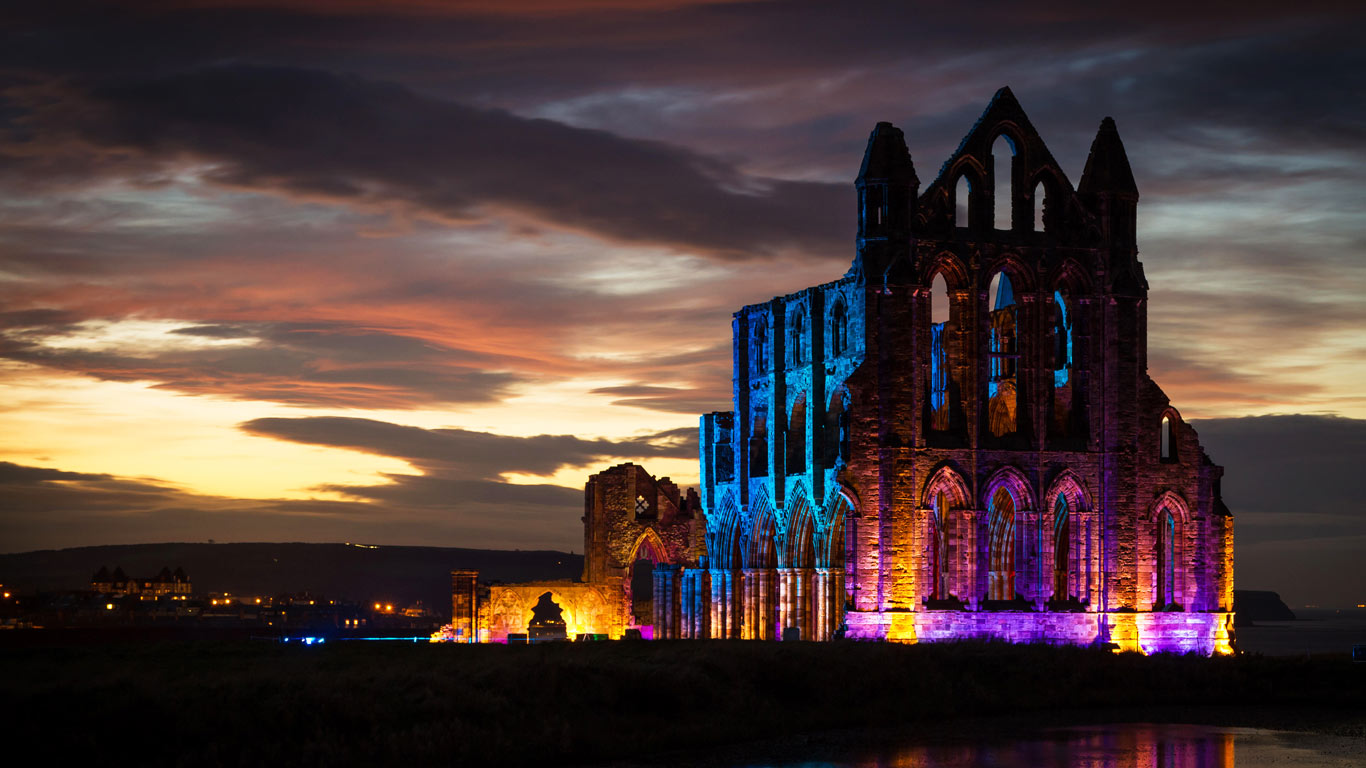 Whitby Abbey illuminated with coloured floodlights in North Yorkshire (© Andrew Barker/Alamy)(Bing United Kingdom)