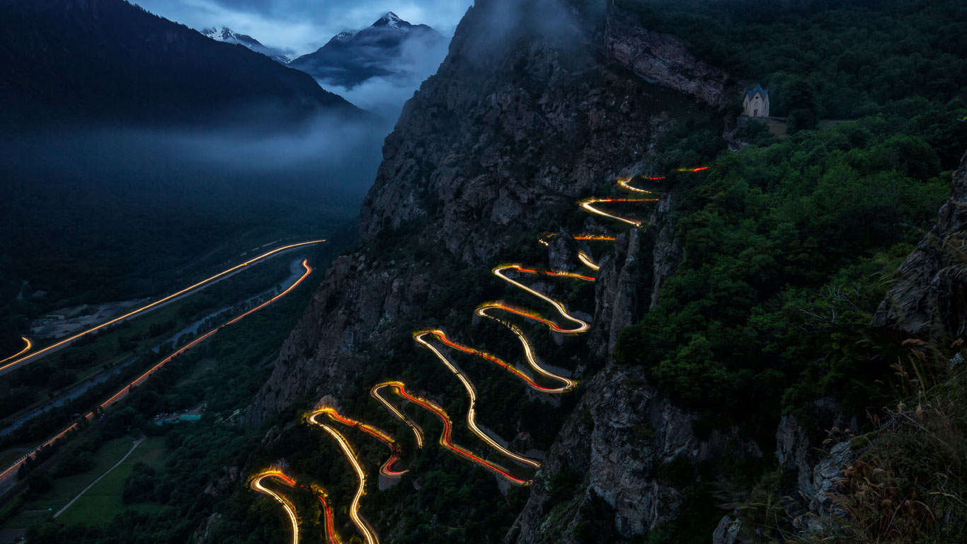 Mountain road illuminated by headlights, Lacets De Montvernier, France (© Olha Rohulya/500px)(Bing New Zealand)
